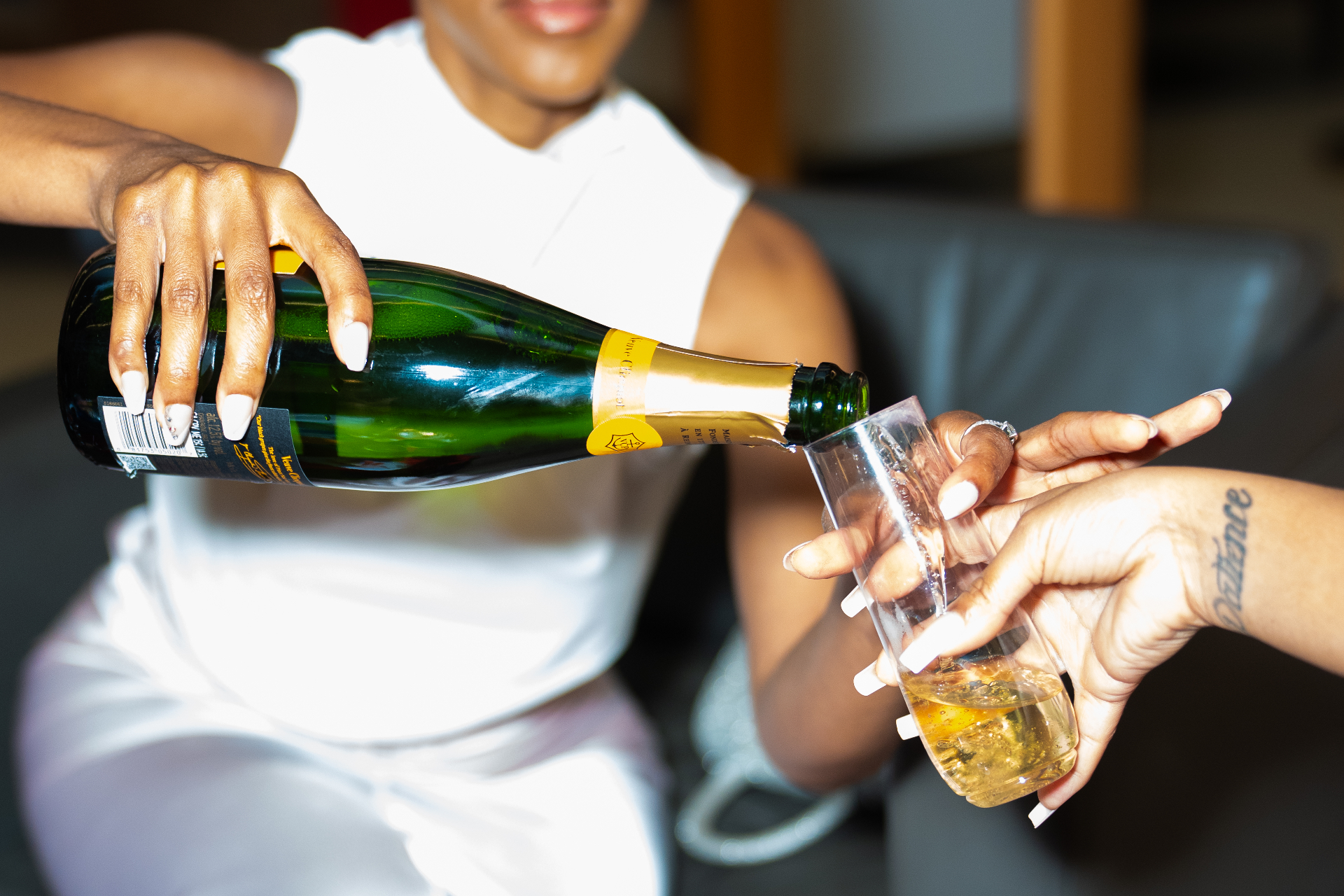 Veuve Clicquot champagne pour at the Sorelle Society Aston Martin F1 event